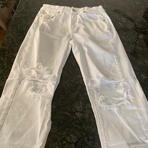 American Eagle, stretch, white pants, size 2, lots of rips in them.